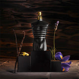Jean Paul Le Male 125ml perfume bottle with black cap and sleek design, displayed in a close-up image.