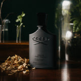 Green Irish Tweed Creed men's fragrance 100ml bottle with green packaging and elegant design.