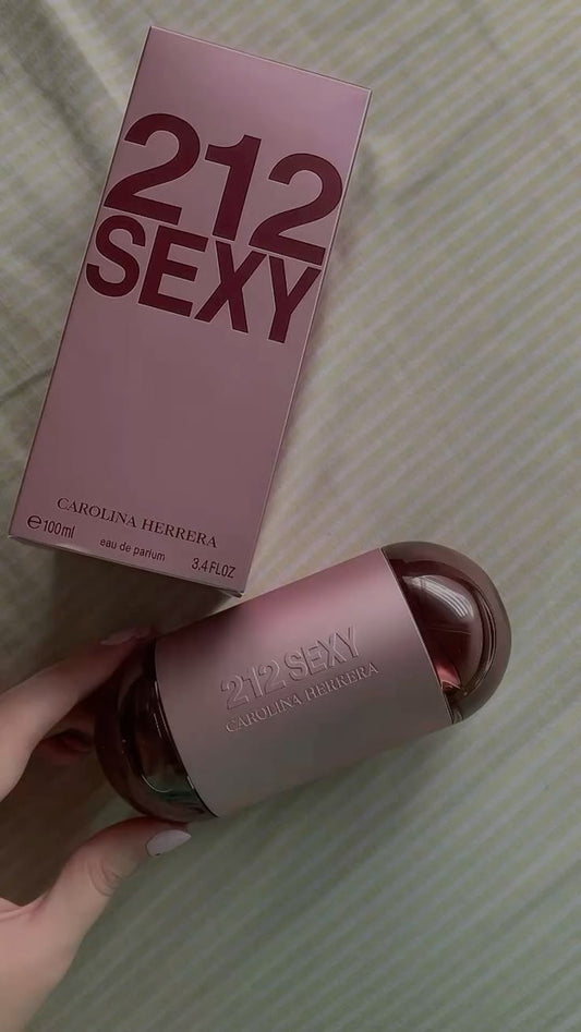 212 Sexy Carolina Herrera perfume bottle for women, elegant glass container with floral and modern design, displayed on a neutral background.