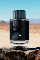 Montblanc Explorer men's perfume bottle with sleek design, featuring a dark cap and transparent glass showcasing the fragrance inside.