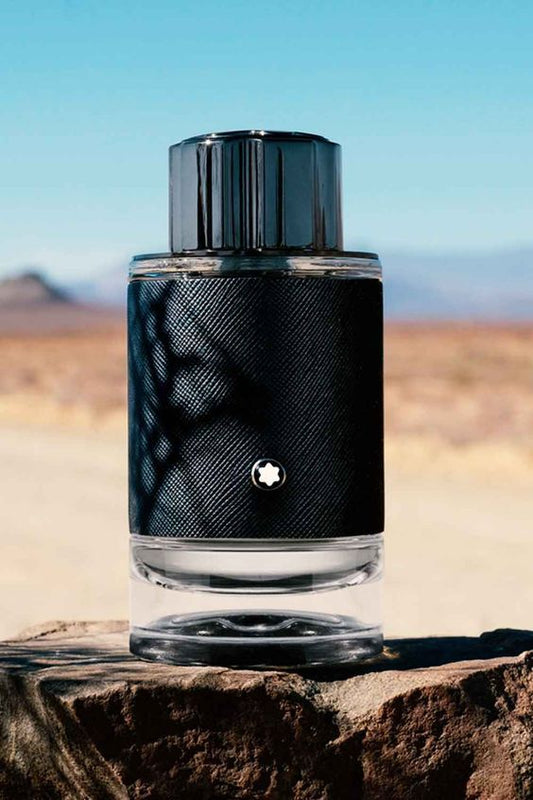 Montblanc Explorer men's perfume bottle with sleek design, featuring a dark cap and transparent glass showcasing the fragrance inside.