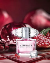 Bright Crystal Versace perfume bottle for women, featuring a clear and elegant design with pink accents and a silver cap.