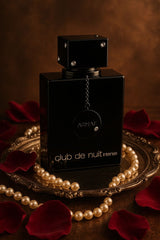 Armaf Club de Nuit Intense Man perfume bottle for men with sleek black design and silver accents.