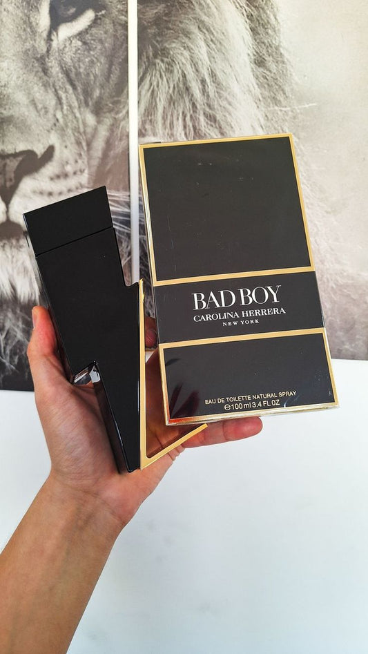 Carolina Herrera Bad Boy men's perfume bottle with sleek black design, featuring bold branding and modern aesthetic.